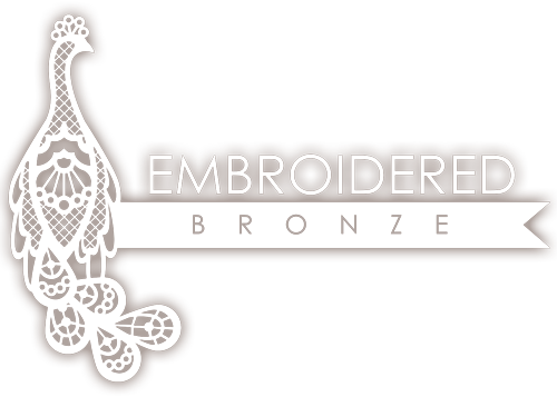 embroidered bronze logo